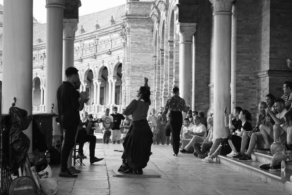 Flamenco performance under the arches of Plaza de España in Seville
